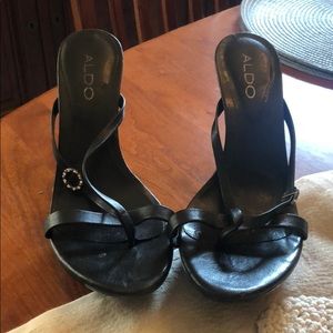 Black Aldo pumps.
